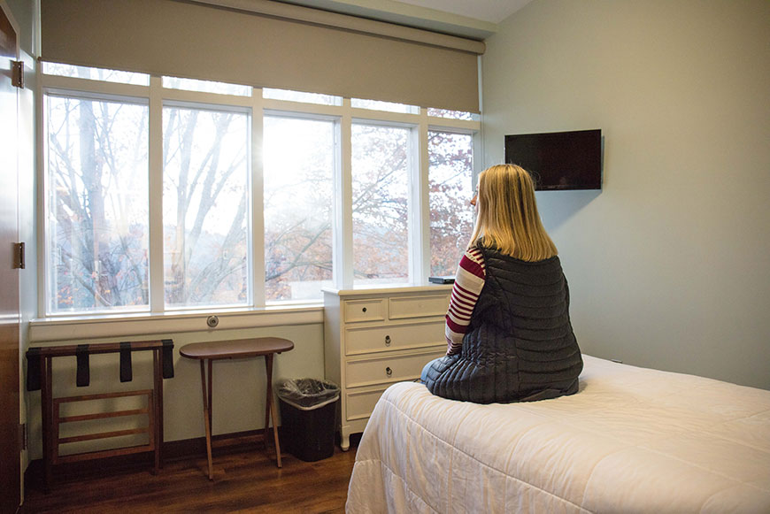 Woman sitting in Detox Room.