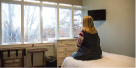 A person sitting on a bed