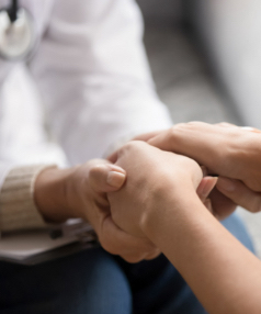 Two people holding hands