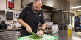 A man cutting vegetables